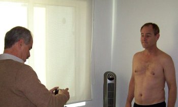 Dr. Jimenez del Toro photographing Dave Clingman before his liposuction surgery at Clinica del Pilar, Guadalajara