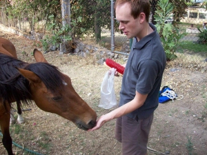 Andrew Wharton feeds his adopted horse, Jorge, at the San Jose del Tajo RV motorhome park in Tlajomulco, Jalisco, Mexico, near Guadalajara