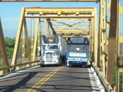 Dave Clingman and Andrew Wharton cross a narrow bridge on Mexico cuota (toll road)